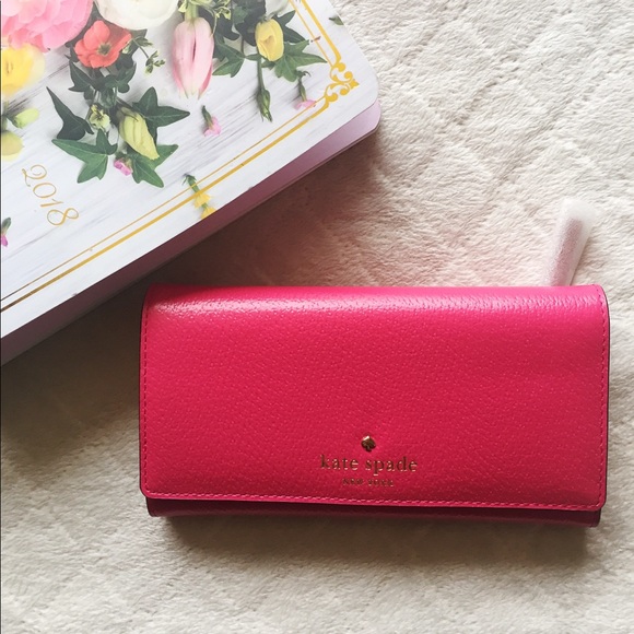 kate spade Handbags - Kate Spade Grand Street Nika pink trifold wallet